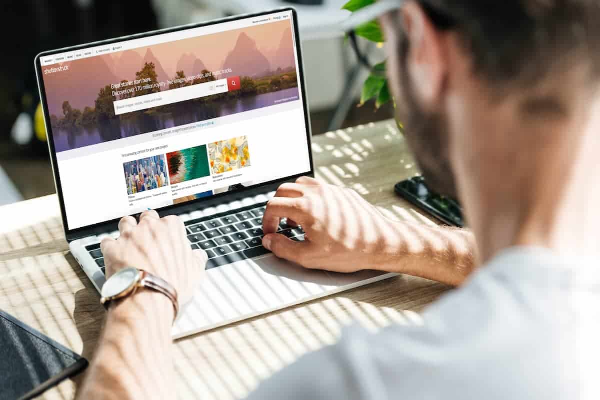 Man Searching for Images Using Stock Photo Site